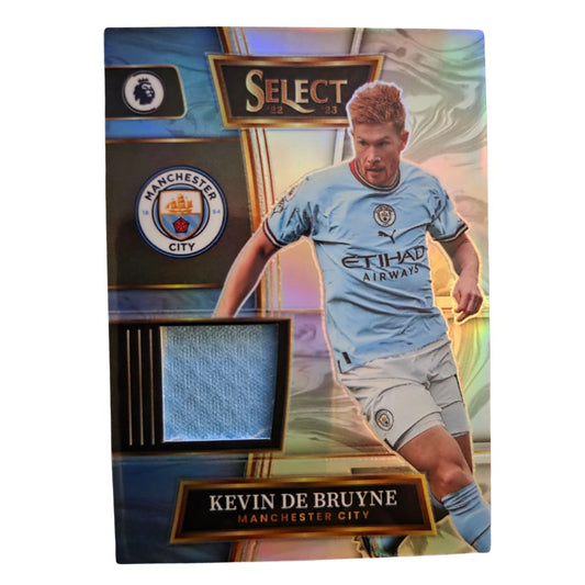 Front of Kevin De Bruyne 2022-23 Panini Select Premier League Select Swatches Prizm relic card featuring Manchester City player and blue fabric patch
