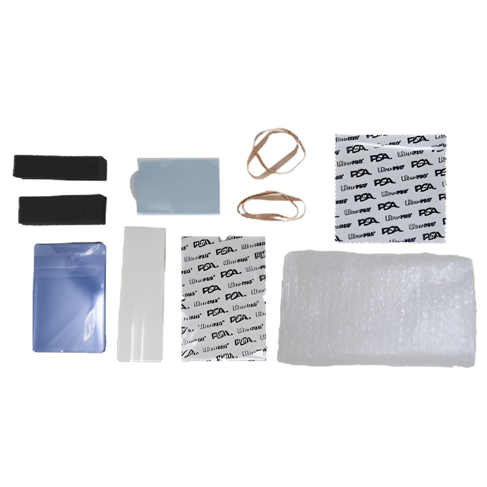 Contents of the Ultra PRO PSA Grading Submission Kit laid out, including card holders, sleeves, cloth and packing materials.