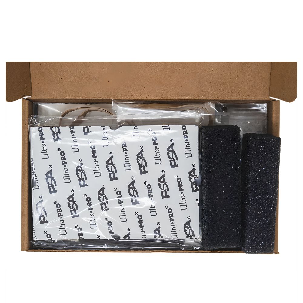 Top view of the opened Ultra PRO PSA Grading Submission Kit showing packed accessories and black foam padding.